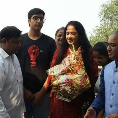 Shubhkarman volunteers with children and families at a distribution drive