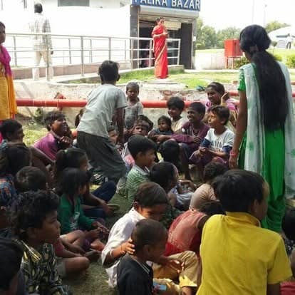 Shubhkarman volunteers handing out supplies to children at a drive in Delhi
