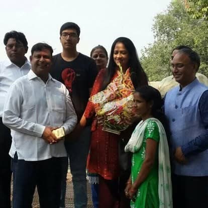 Shubhkarman volunteers with children and families at a distribution drive